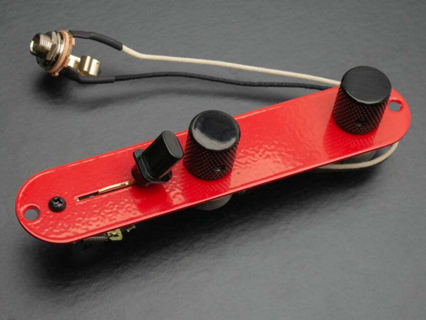 red tele plate with black knobs