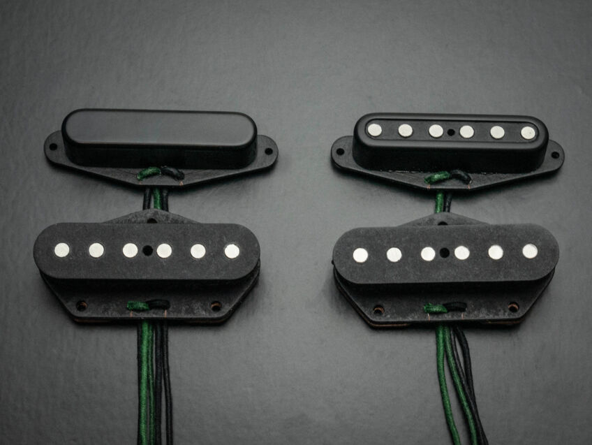 two sets of black tele pickups, one covered one open