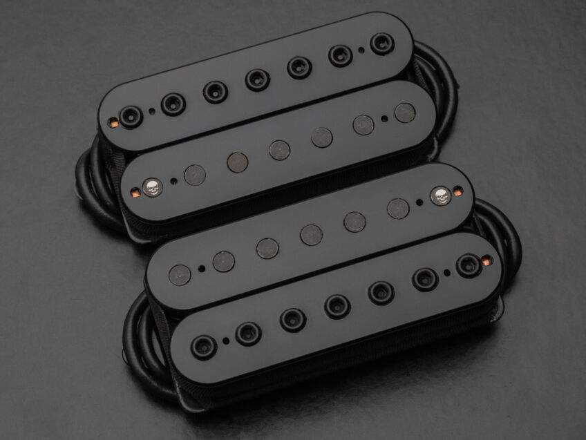 black open humbucker with skull etch on poles
